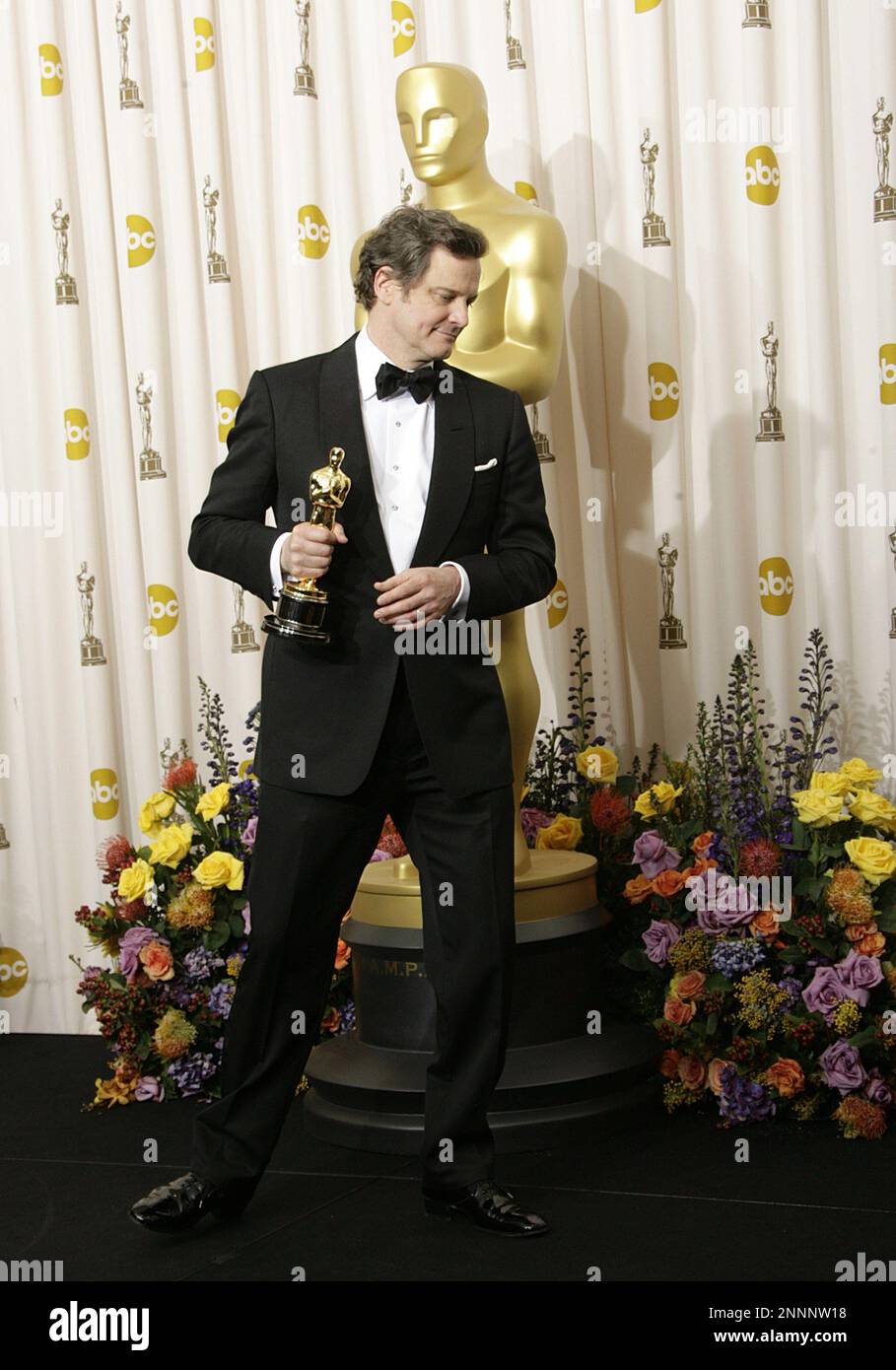 Actor Colin Firth holds the award for Best Actor in a Motion Picture for his role in 'The King's Speech' poses in the press room at the 83rd Annual Academy Awards held at the Kodak Theatre on February 27, 2011 in Hollywood, California. Photo by Francis Specker Stock Photo