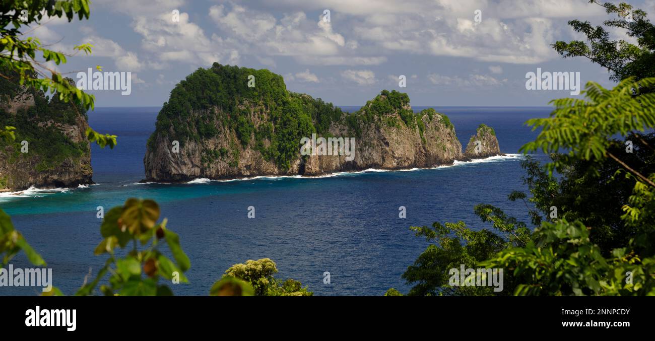 Vai'ava Strait, a rock island outcrop extending from the island of Tutuila, American Samoa and part of the National Park of American Samoa Stock Photo