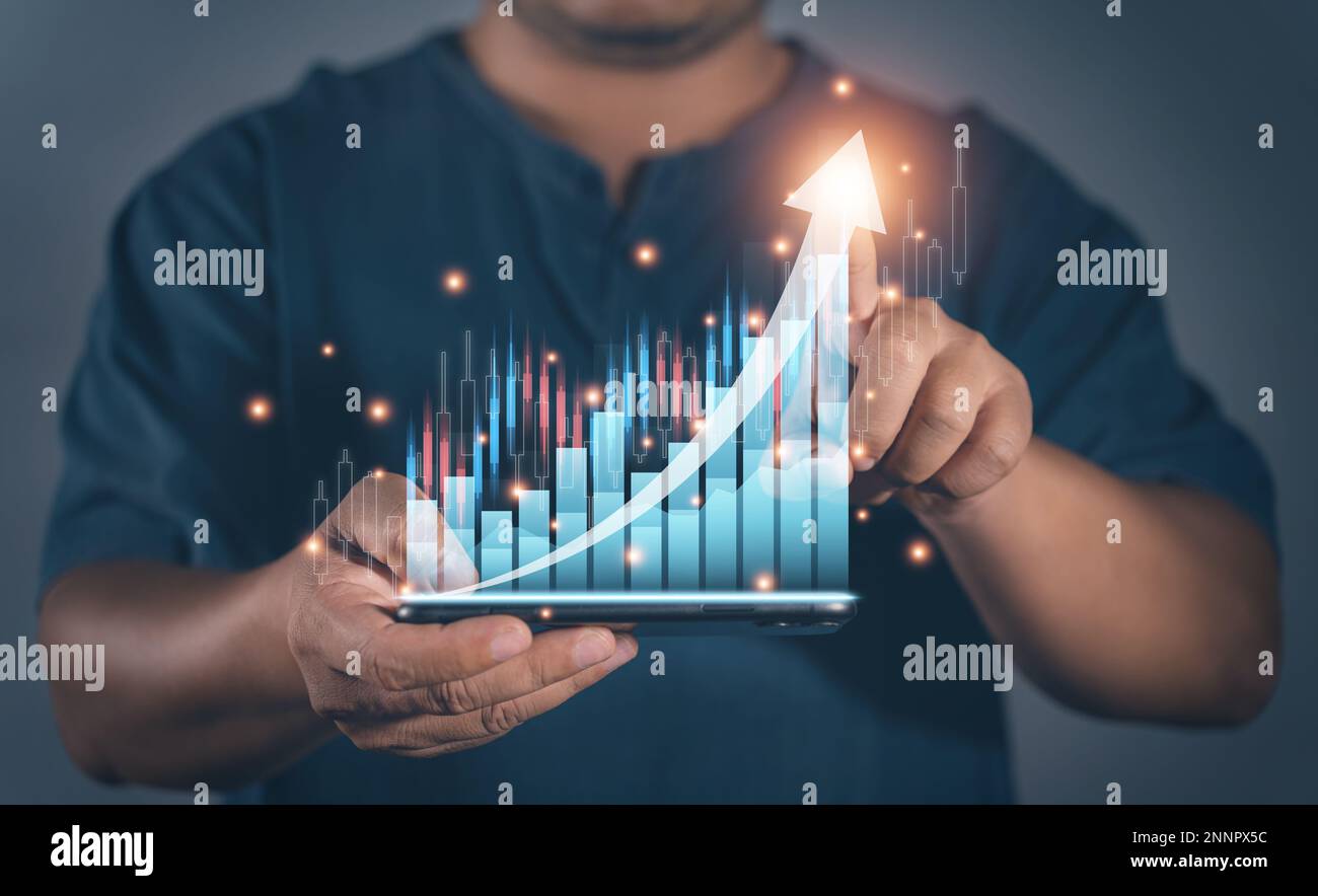 Business man point plan growth increase of positive indicators graph in his business. Planning of business, Graph growth success concept. Stock market Stock Photo