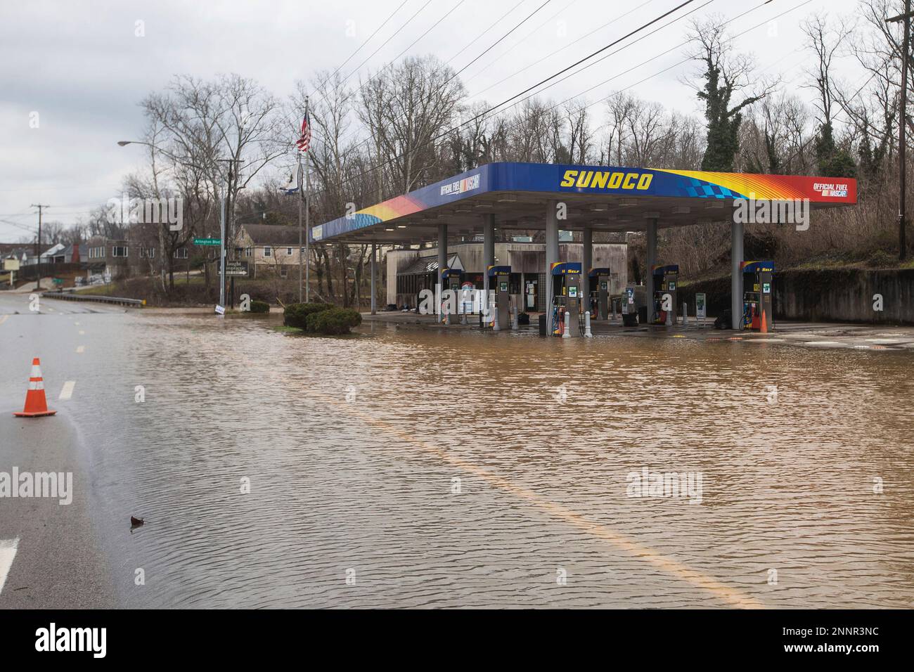 Water from the Guyandotte River floods a Sunoco gas station near