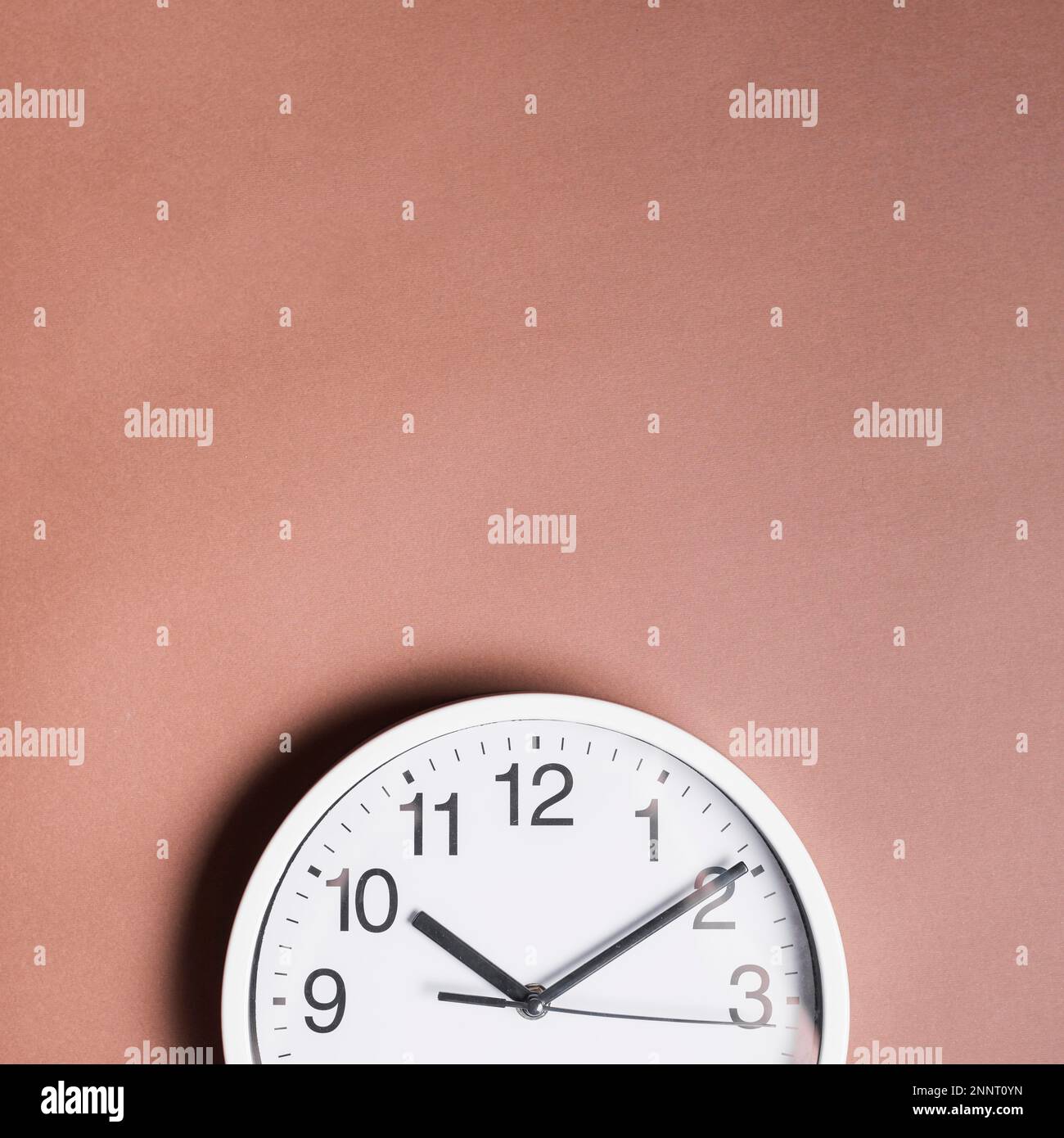 high angle view alarm clock brown backdrop. Beautiful photo Stock Photo