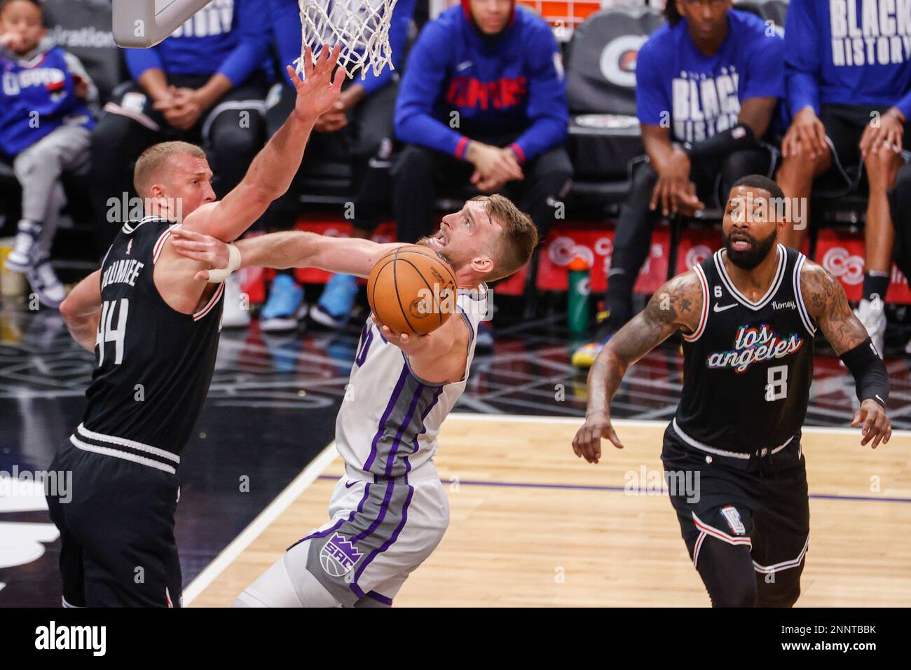 Los Angeles, United States. 28th Feb, 2023. Los Angeles Clippers forward Paul  George (R) drives past Minnesota Timberwolves forward Jaden McDaniels (L)  during an NBA game. Timberwolves 108:101 Clippers (Photo by Ringo