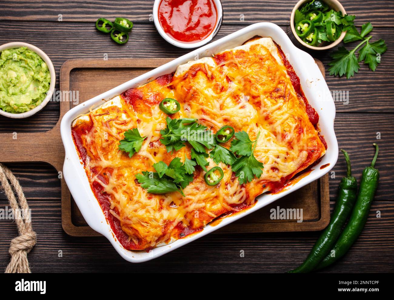 Traditional Mexican dish enchiladas with meat, chili red sauce and