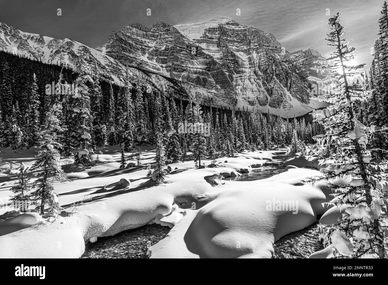 Snow covered Paradise Creek and Mount Temple in black and white, Lake Louise, Alberta, Canada Stock Photo