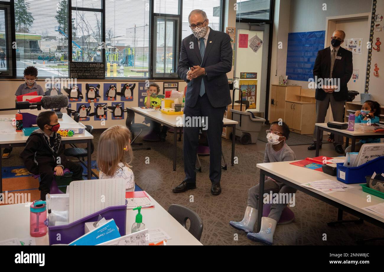Washington Gov. Jay Inslee speaks with kindergartners in Chelsea Singh's class during a visit to