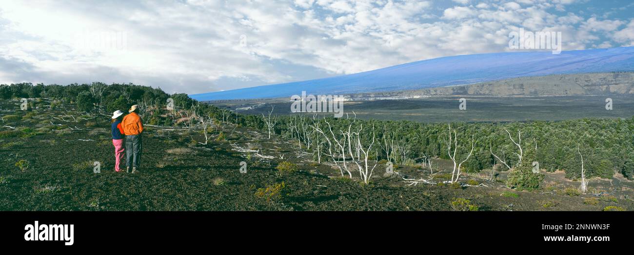 Hikers looking at Kilauea Crater and Mauna Loa, Hawaii Volcanoes