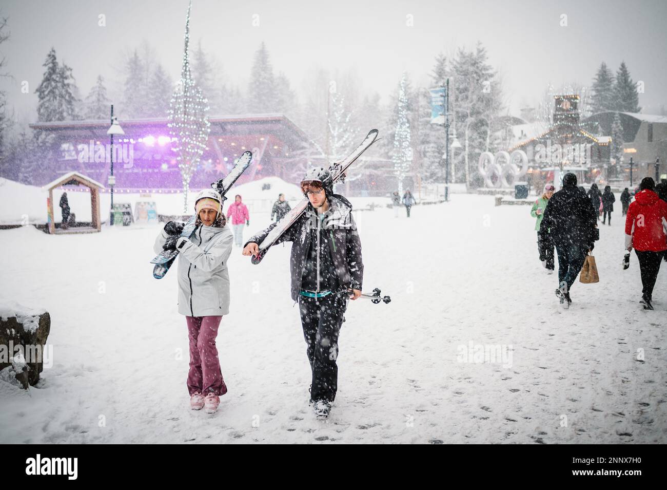 Whistler tourists on a snowy afternoon in the winter.  Whistler BC, Canada. Stock Photo