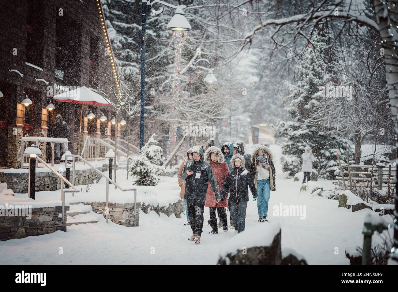 Whistler tourists on a snowy afternoon in the winter.  Whistler BC, Canada. Stock Photo