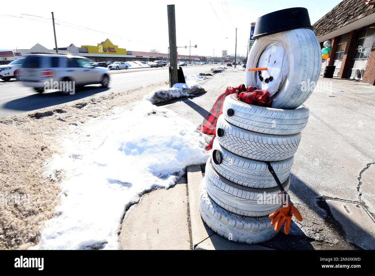 A stack of tires becomes a snowman at Cole Muffler in Edwardsville
