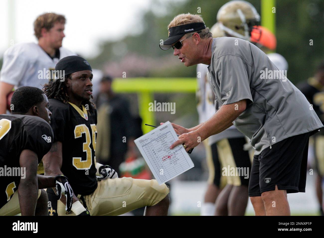 04 August 2009: Saints defensive coordinator Gregg Williams talks with  defensive backs Danny Gorrer (38) and Reggie Jones (35) during New Orleans  Saints training camp at the team's practice facility in Metairie,