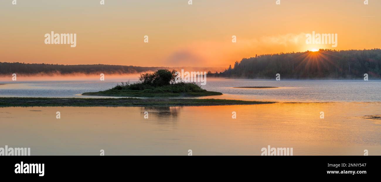 Lake at dawn with fog, Winagami Lake Provincial Park, Alberta, Canada Stock Photo