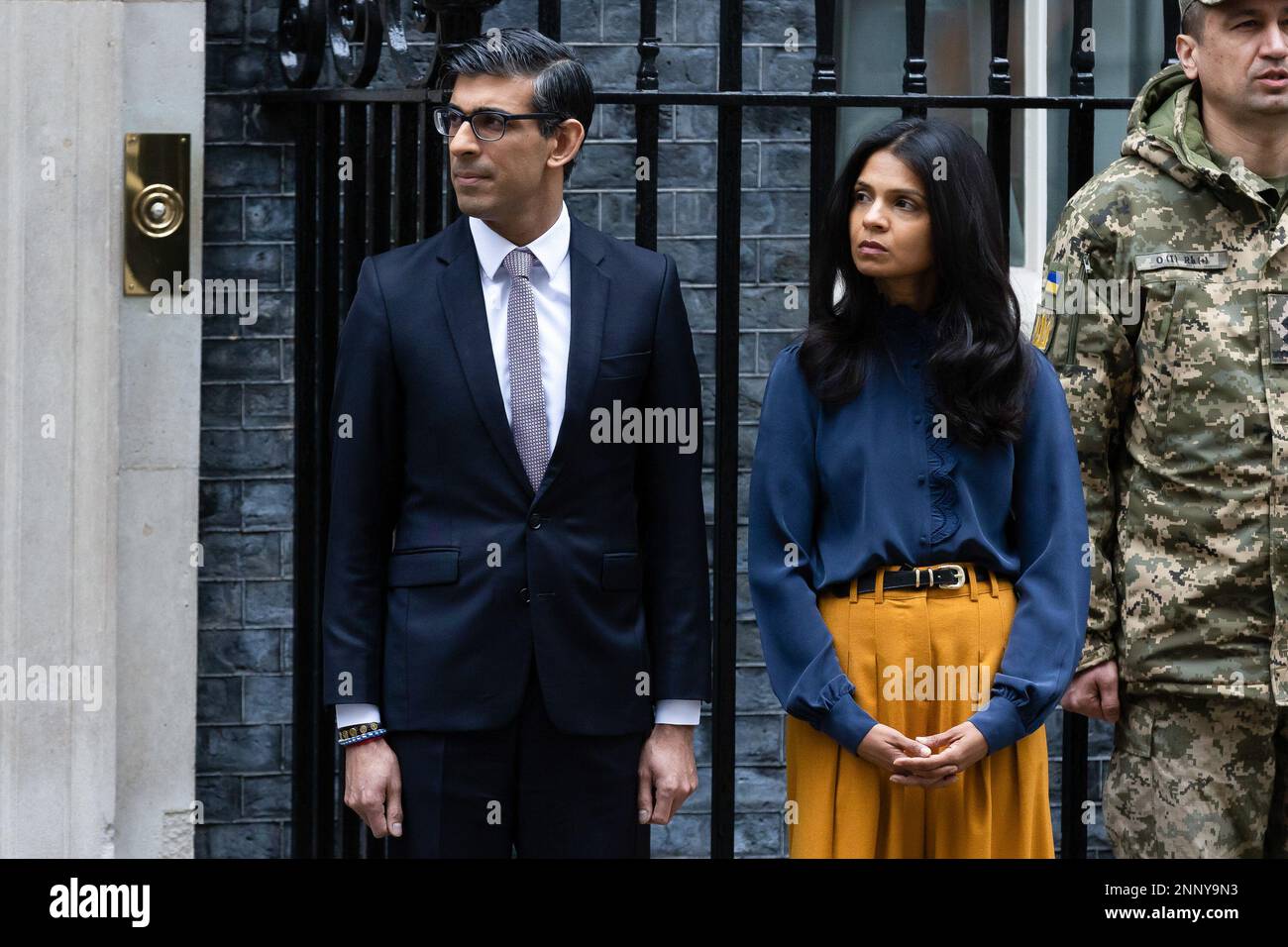 London, UK. 24th Feb, 2023. British Prime Minister Rishi Sunak and his wife Akshata Murthy observe a minute's silence outside 10 Downing Street. The world is marking the one-year anniversary of the full-scale Russian invasion of Ukraine. Credit: SOPA Images Limited/Alamy Live News Stock Photo