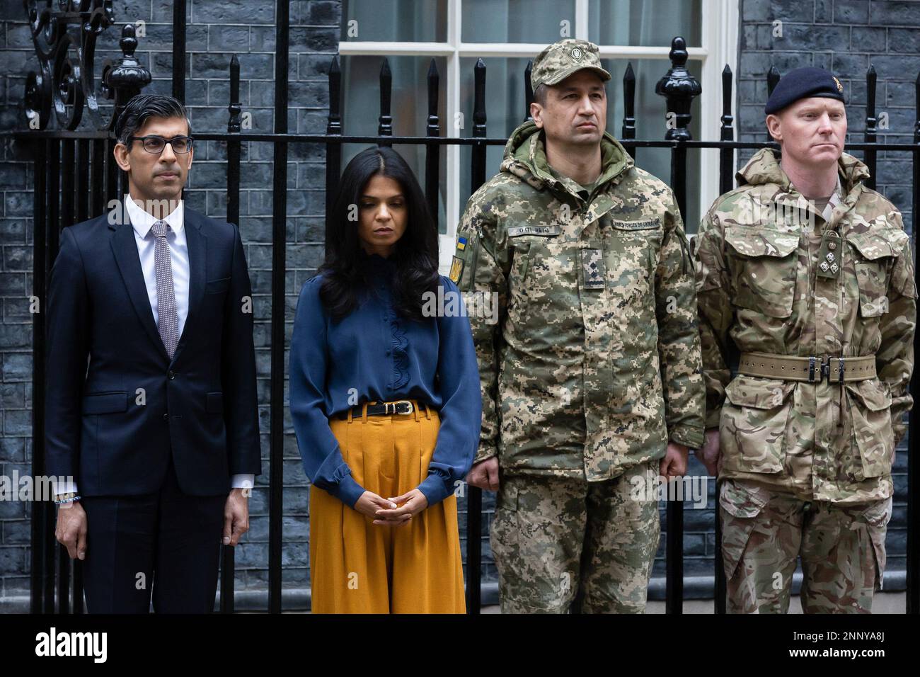 London, UK. 24th Feb, 2023. British Prime Minister Rishi Sunak and his wife Akshata Murthy observe a minute's silence outside 10 Downing Street. The world is marking the one-year anniversary of the full-scale Russian invasion of Ukraine. Credit: SOPA Images Limited/Alamy Live News Stock Photo
