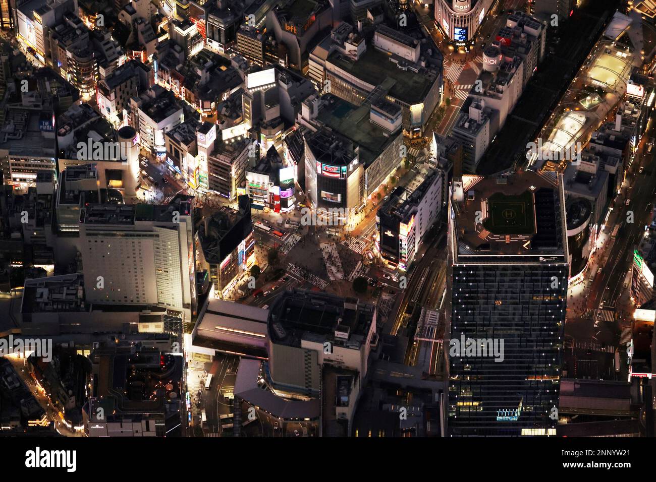 An aerial photo shows a night site of Shibuya Scramble Crossing in ...