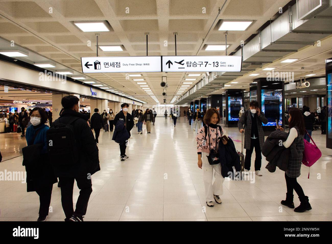 Korean people and foreign traveler passengers walking carry luggage bag ...