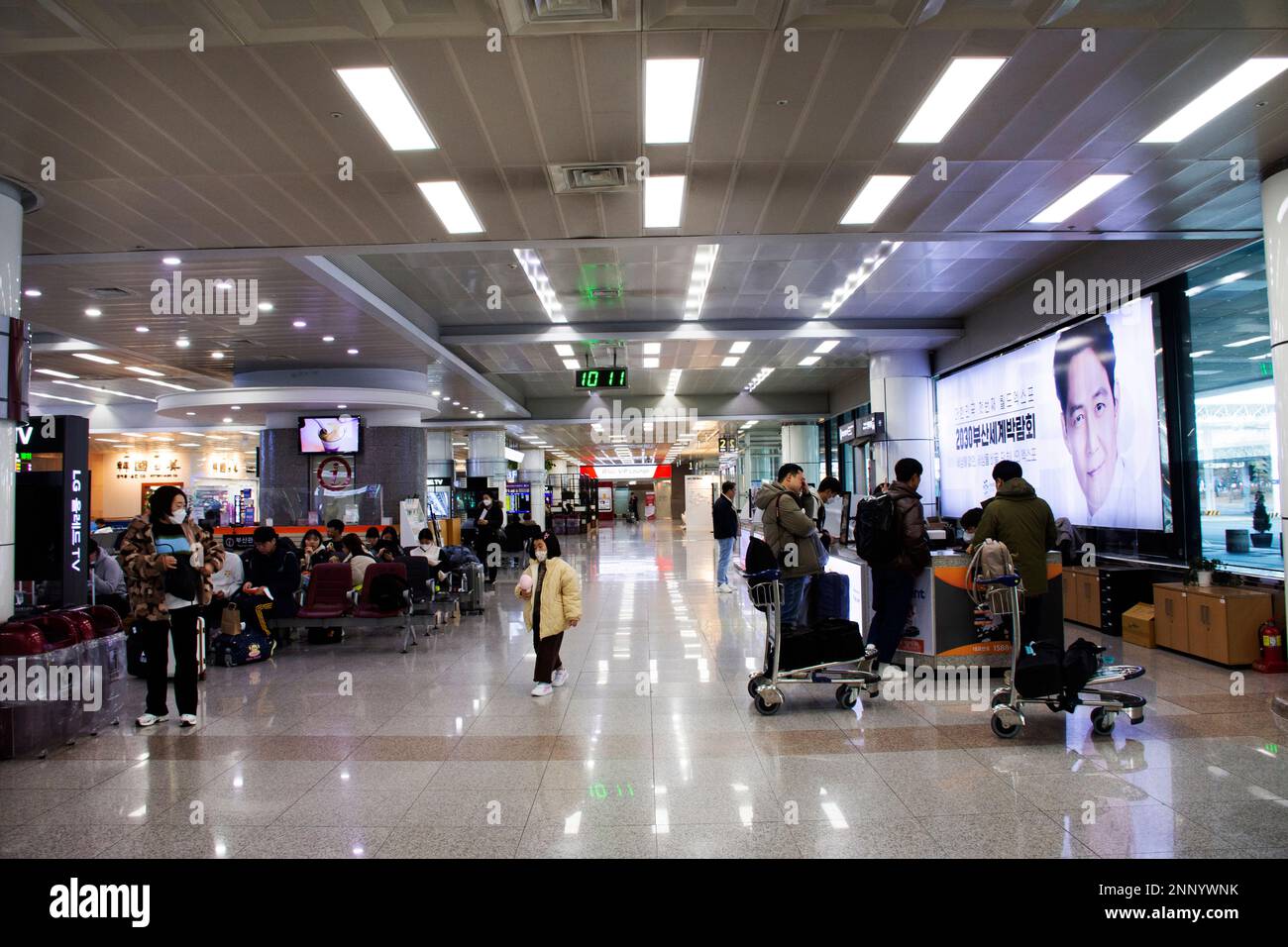 Korean people and foreign traveler passengers walking carry luggage bag