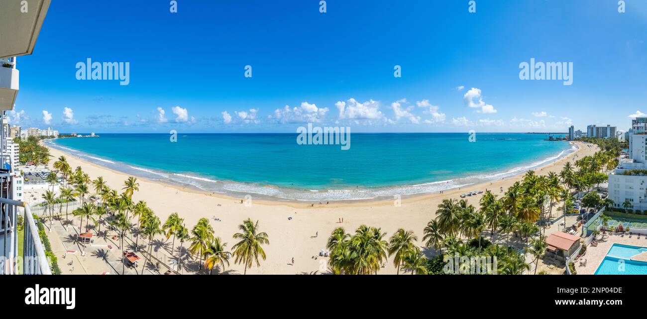 Tropical beach with palm trees, Isla Verde Beach, Carolina, Puerto Rico Stock Photo