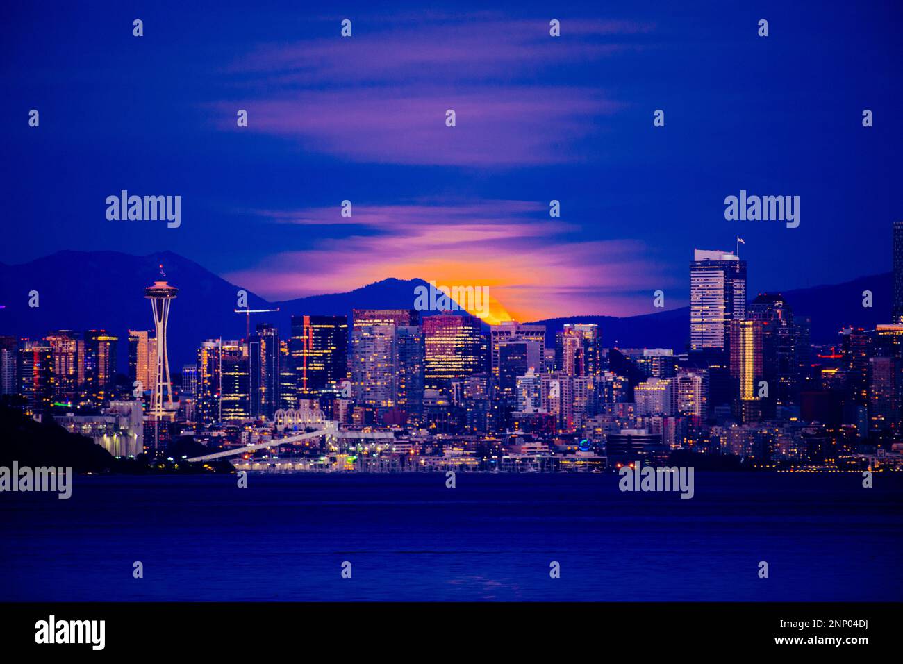 Moon over skyline of Seattle at night, Washington State, USA Stock