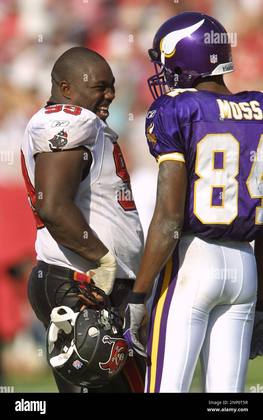 3 Nov 2002: Randy Moss of the Minnesota Vikings talks with Warren Sapp ...