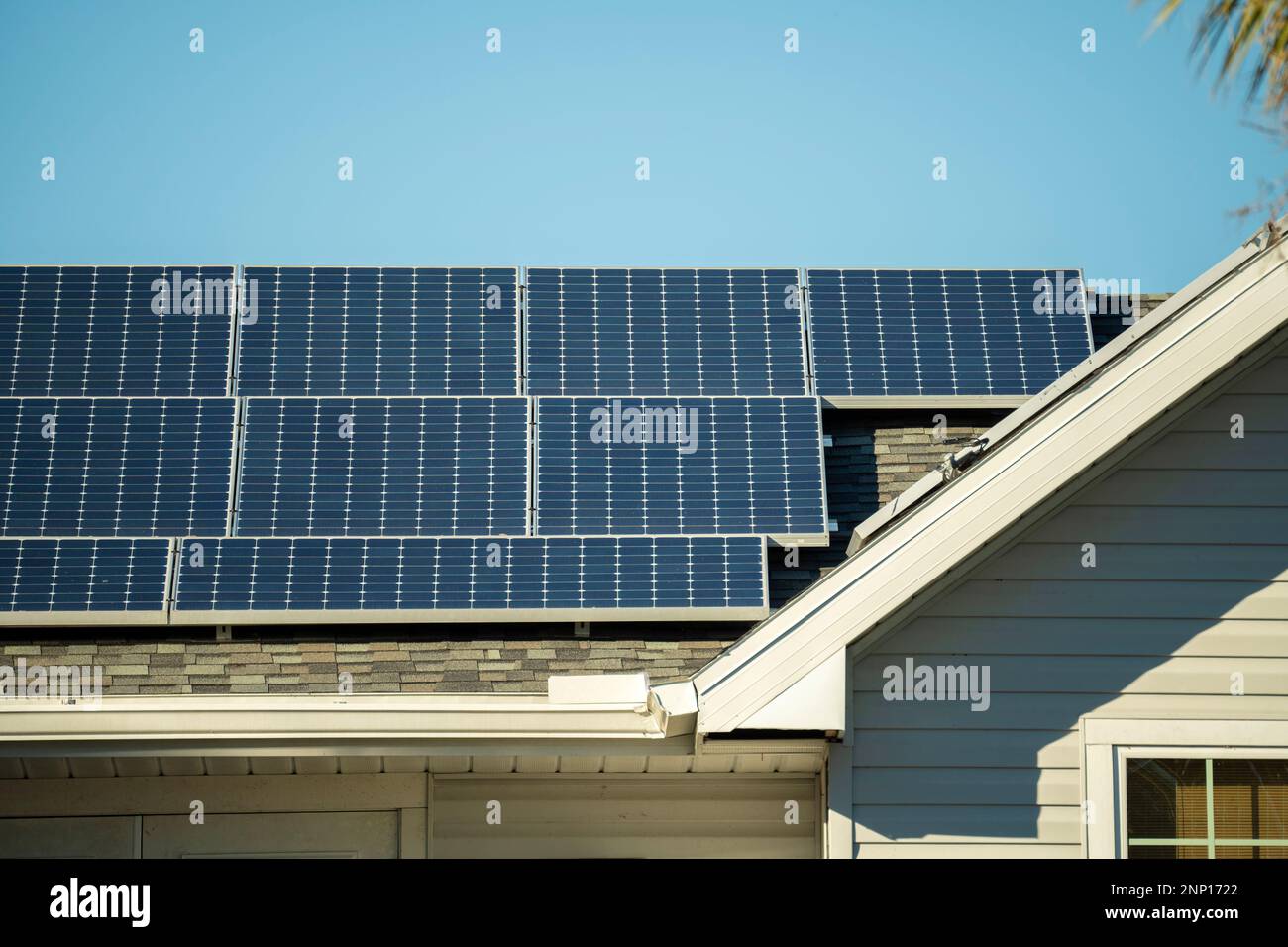 Standard american residential house with rooftop covered with solar