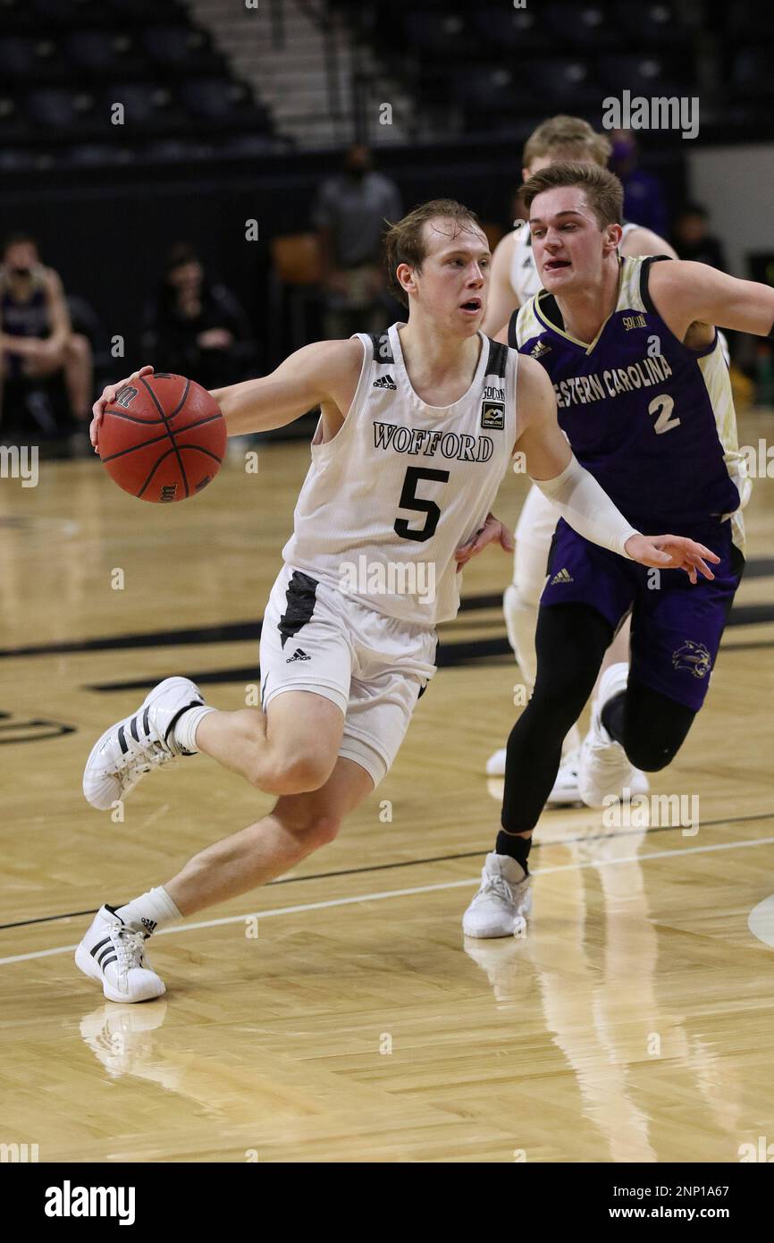 SPARTANBURG, SC - JANUARY 23: Storm Murphy (5) guard of Wofford drives to  the basket during a men's college basketball game between the Western  Carolina Catamounts and the Wofford Terriers on January