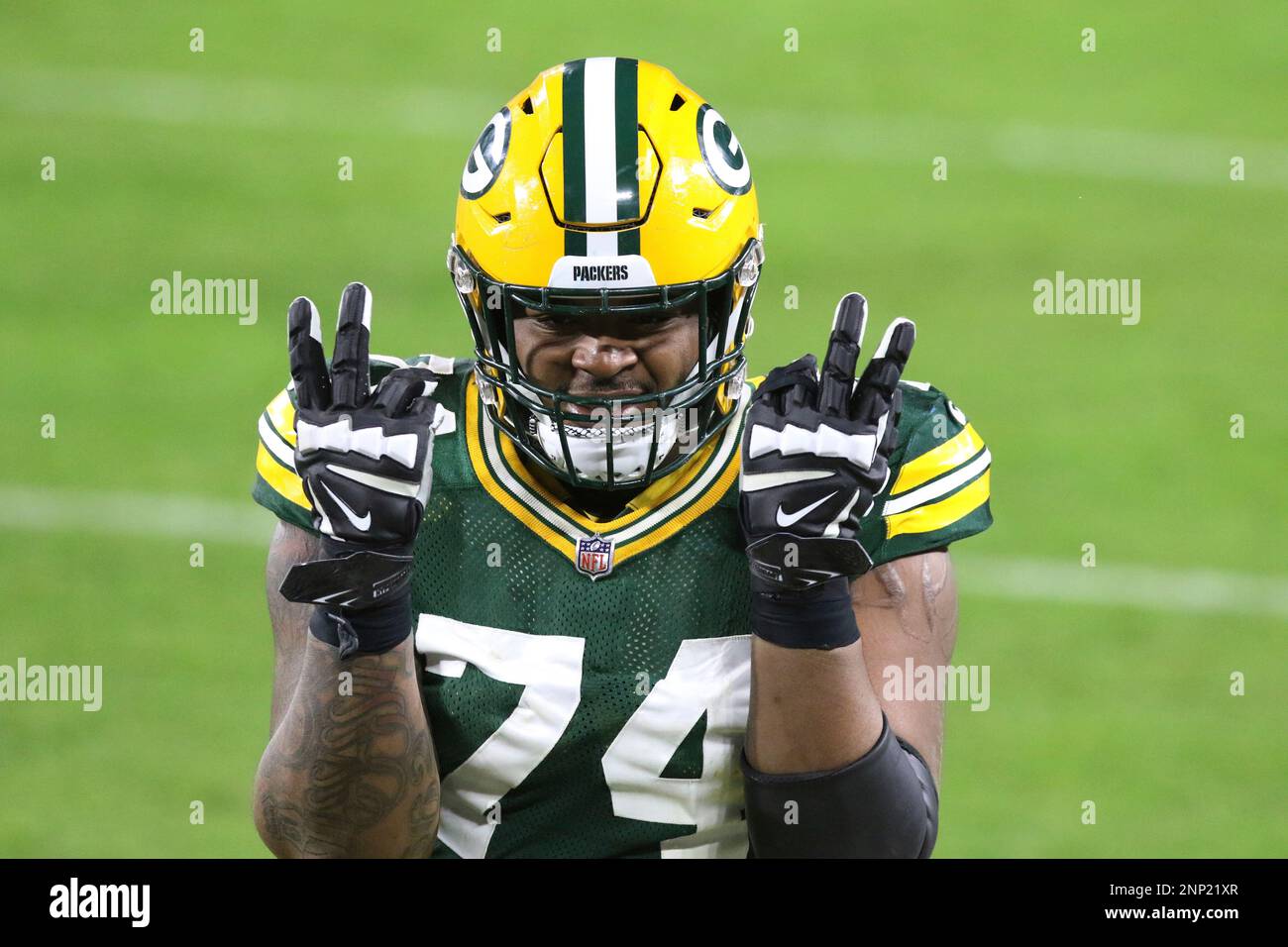 GREEN BAY, WI - JANUARY 16: Green Bay Packers offensive guard Elgton Jenkins  (74) celebrates during a NFL Divisional Playoff game between the Green Bay  Packers and the Los Angeles Rams at