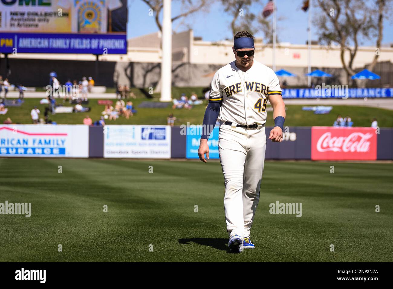 Phoenix, United States. 24th Feb, 2023. Milwaukee Brewers designated hitter  Luke Voit (45) warms up with before an MLB spring training baseball game  against the Los Angeles Dodgers at American Family Fields