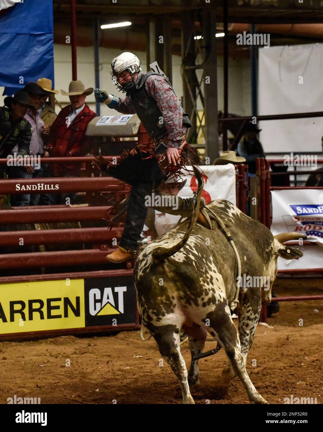 Wyatt Phelps competes in bull riding during the first night of