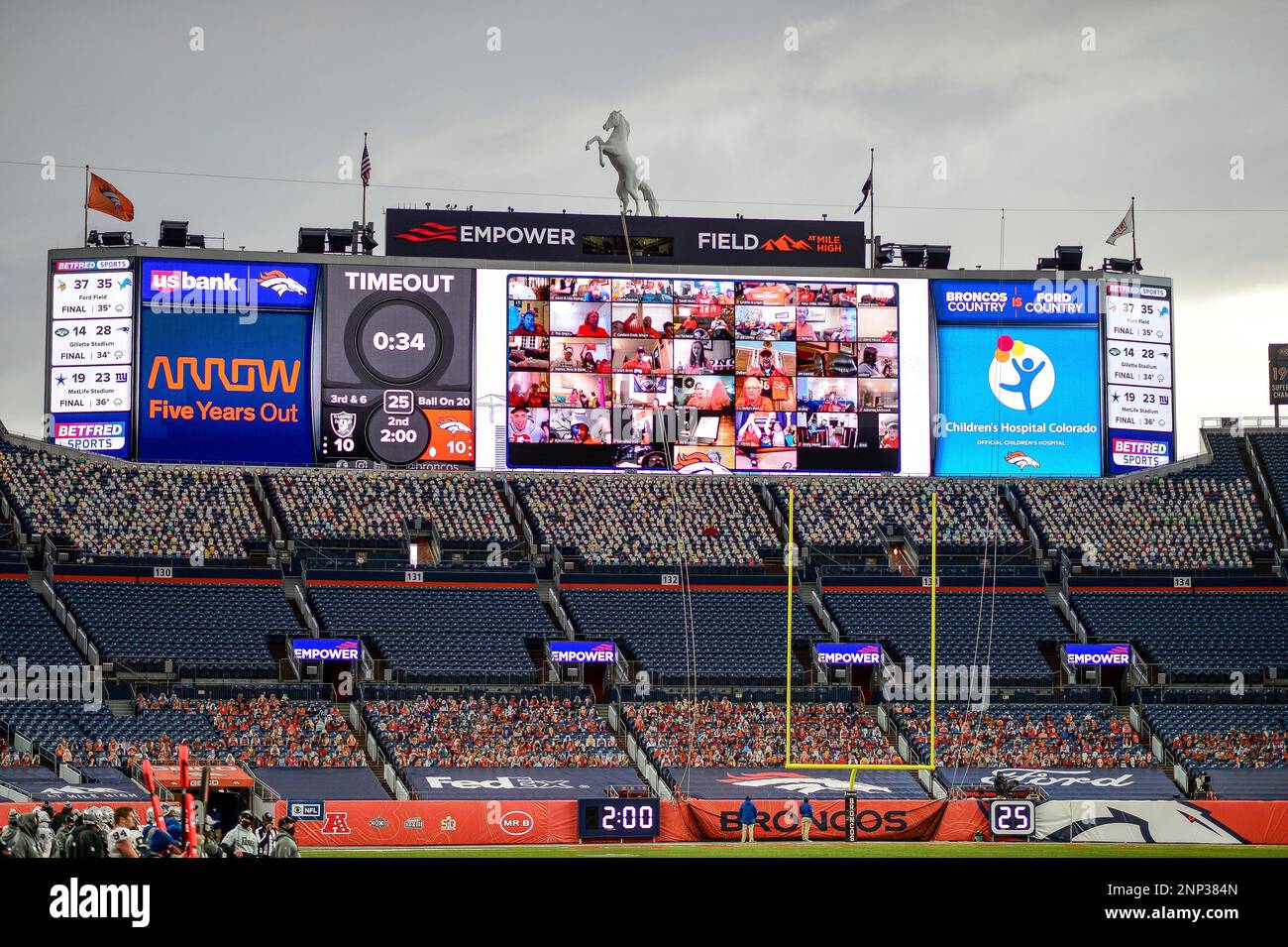 DENVER, CO - JANUARY 03: A Zoom video conference call featuring Broncos  fans calling in from their homes is shown on the jumbotron in a general  view during a game between the