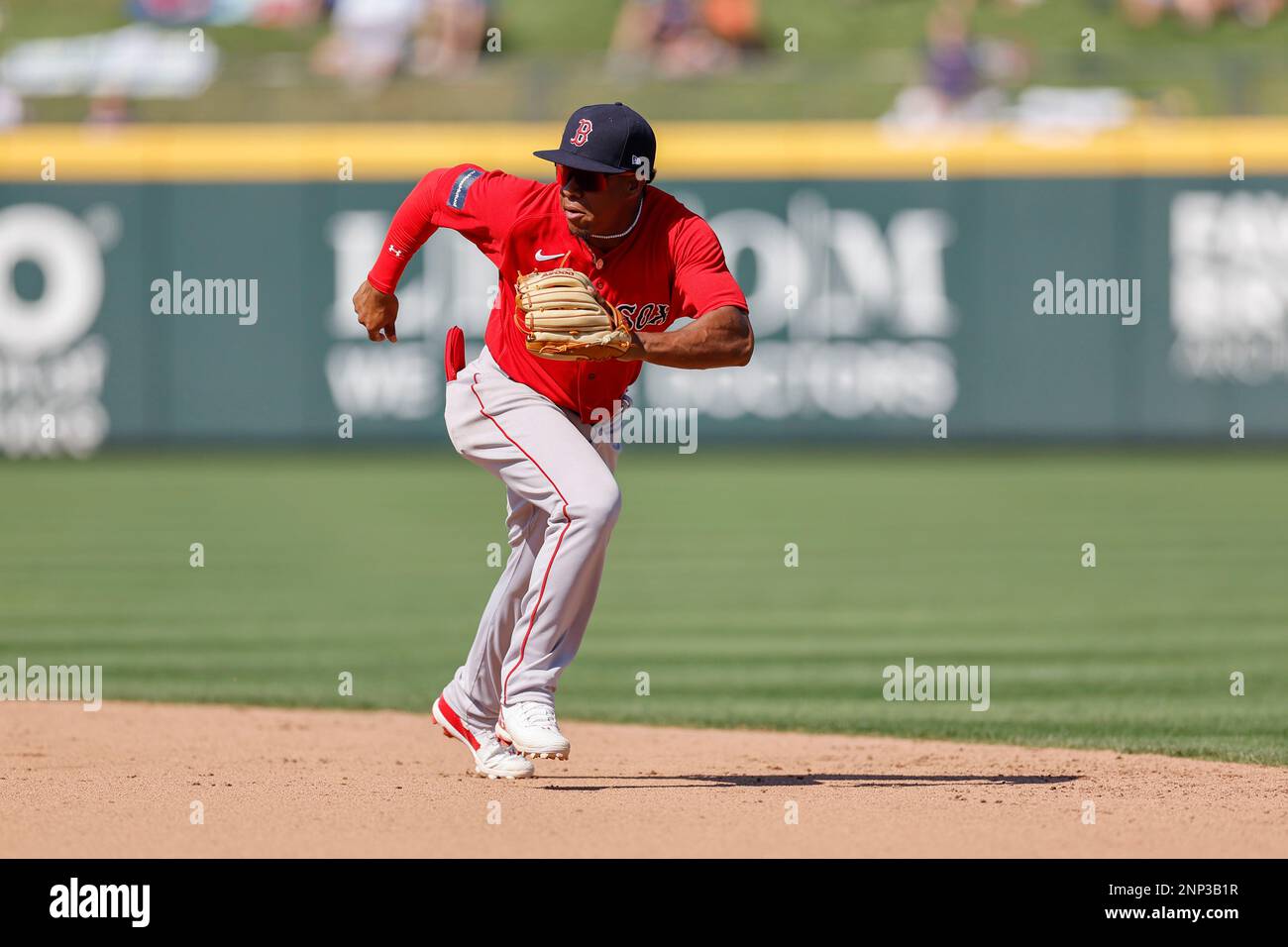 North Port FL USA: Boston Red Sox third baseman Enmanuel Valdez (83) runs to field a hard hit ball and throws to first for the out during an MLB sprin Stock Photo