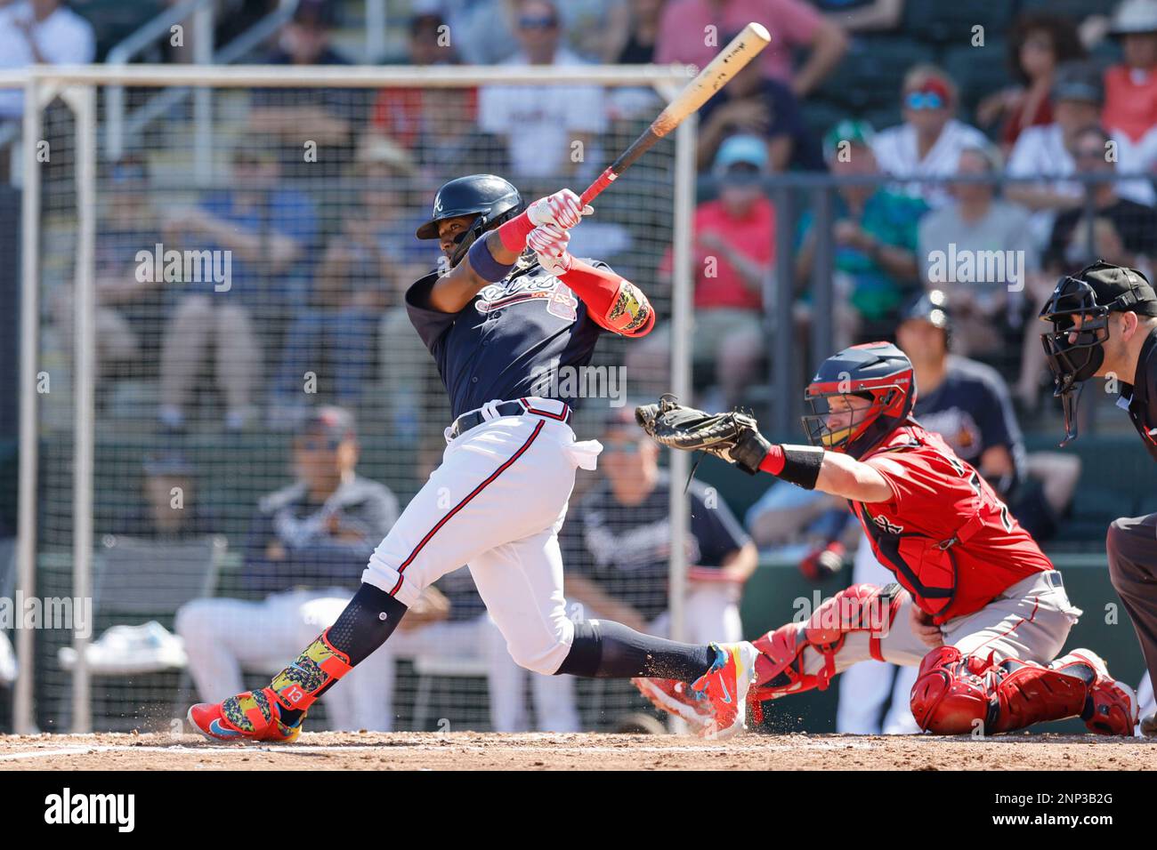 North Port FL USA: Atlanta Braves right fielder Ronald Acuna Jr. (13) hits a single to left field during an MLB spring training game against the Bosto Stock Photo