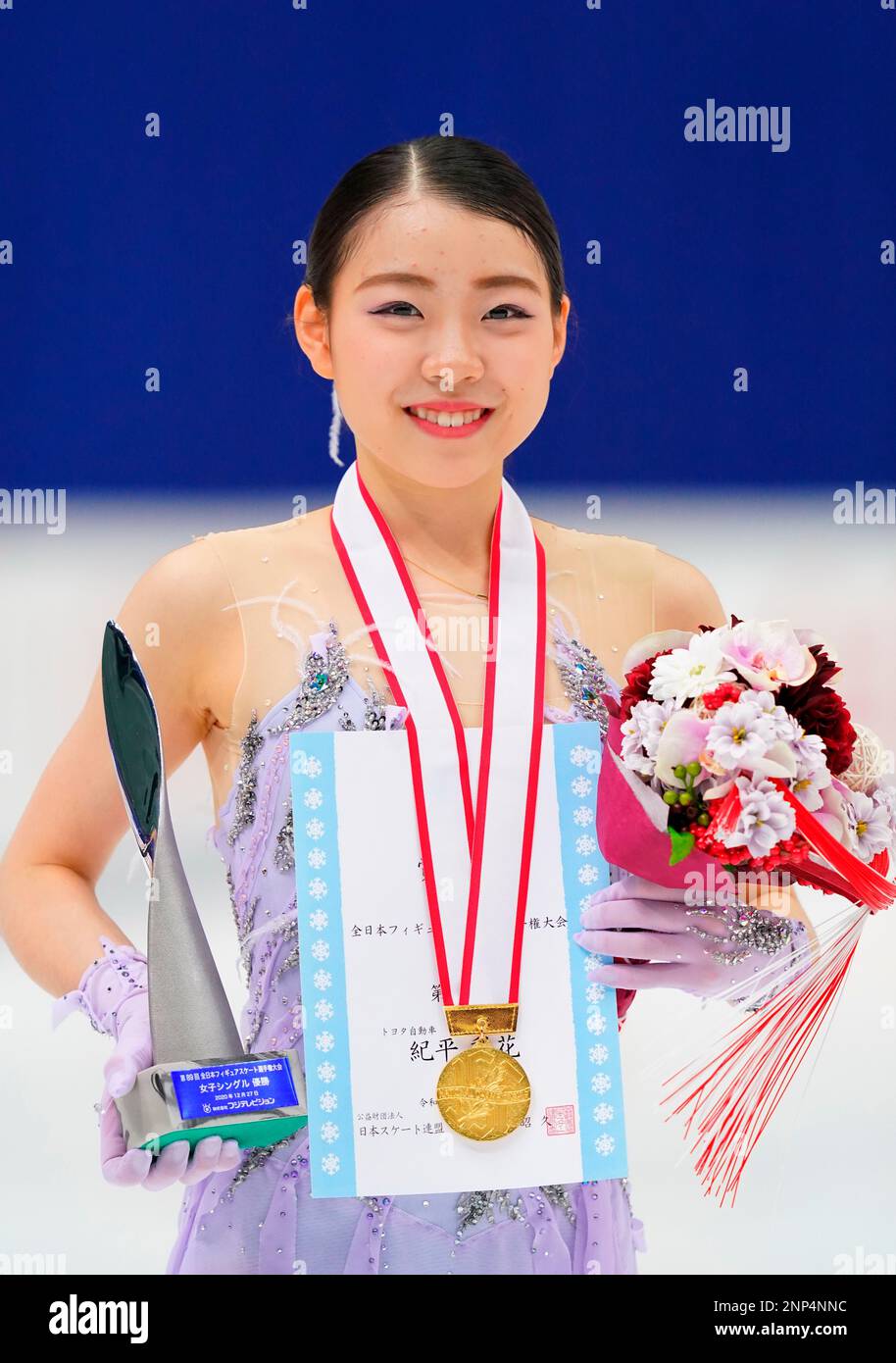 Japanese figure skaters Rika Kihira poses for photo after winning the