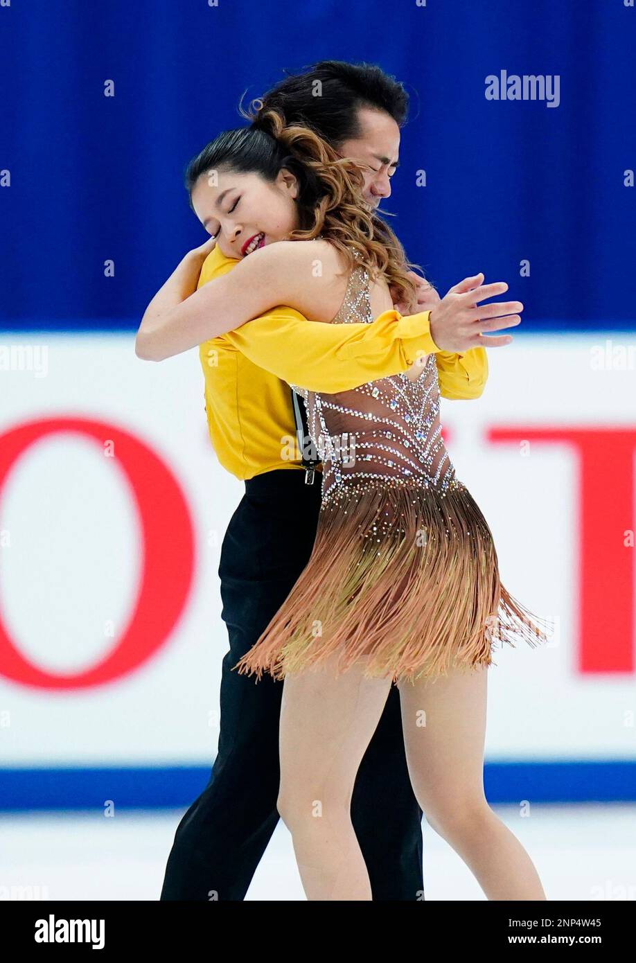 Japanese figure skaters Daisuke Takahashi and Kana Muramoto perform