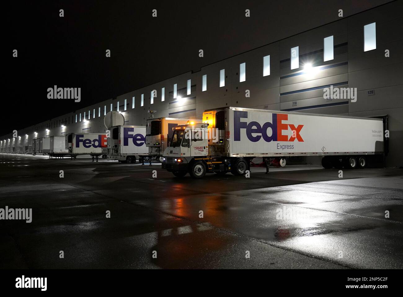 FedEx trucks are parked at the loading dock outside the McKesson