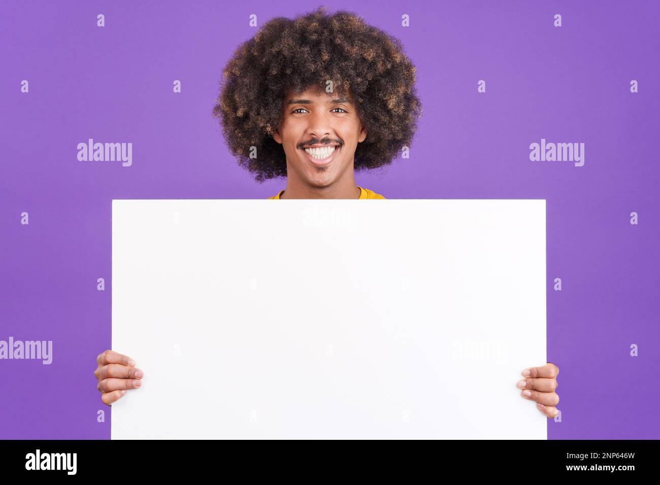 Smiley african man holding a blank panel Stock Photo