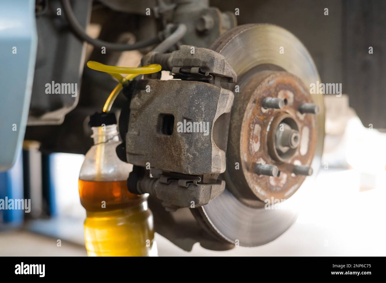 Automatic change of brake fluid in a car service Stock Photo Alamy