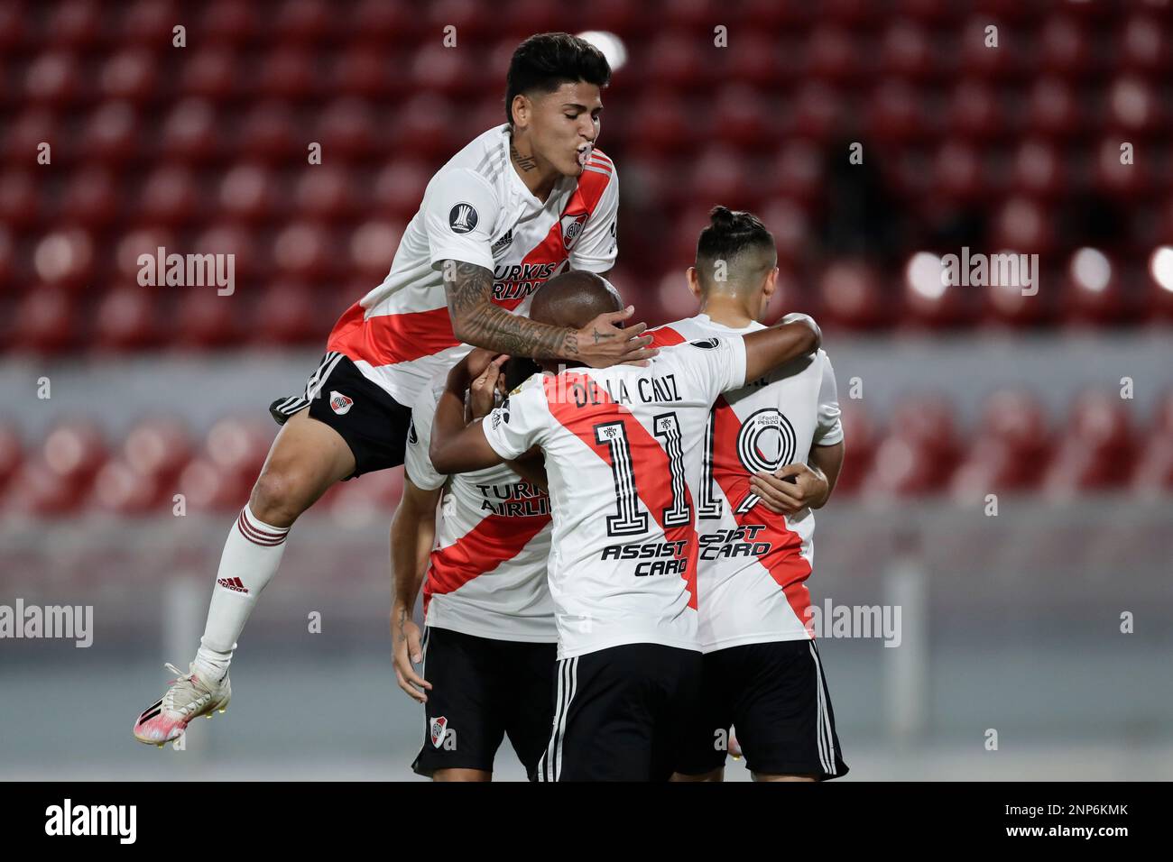 Players of Argentina's River Plate celebrate their side's opening goal scored by teammate Gonzalo Montiel from the penalty spot during a Copa Libertadores quarterfinal first leg soccer match against Uruguay's Nacional at the Libertadores de America stadium in Buenos Aires, Argentina, Thursday, Dec. 10, 2020. (Juan Ignacio Roncoroni/Pool via AP) Stock Photo