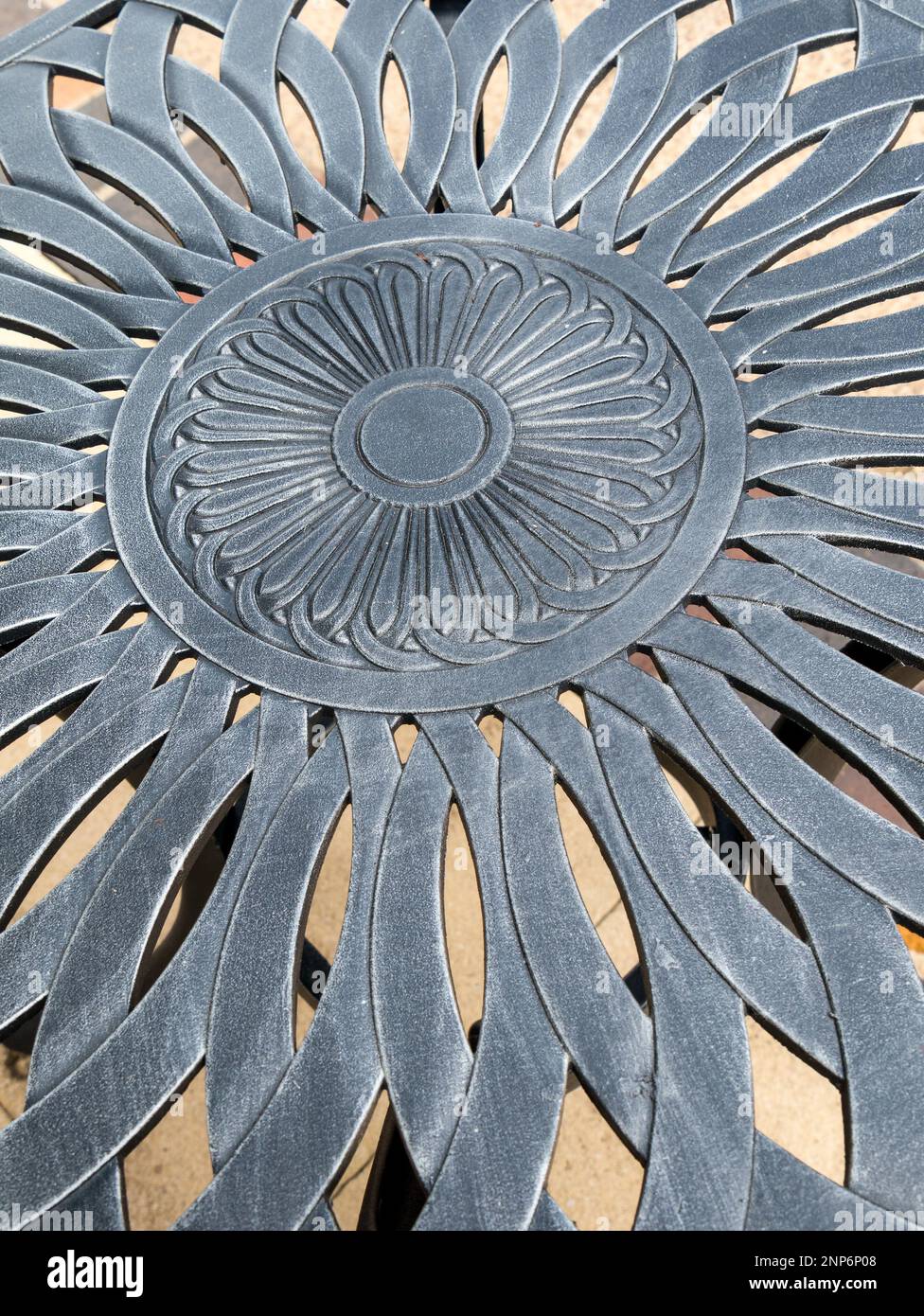 Closeup photo showing detail of floral pattern in cast aluminium metal