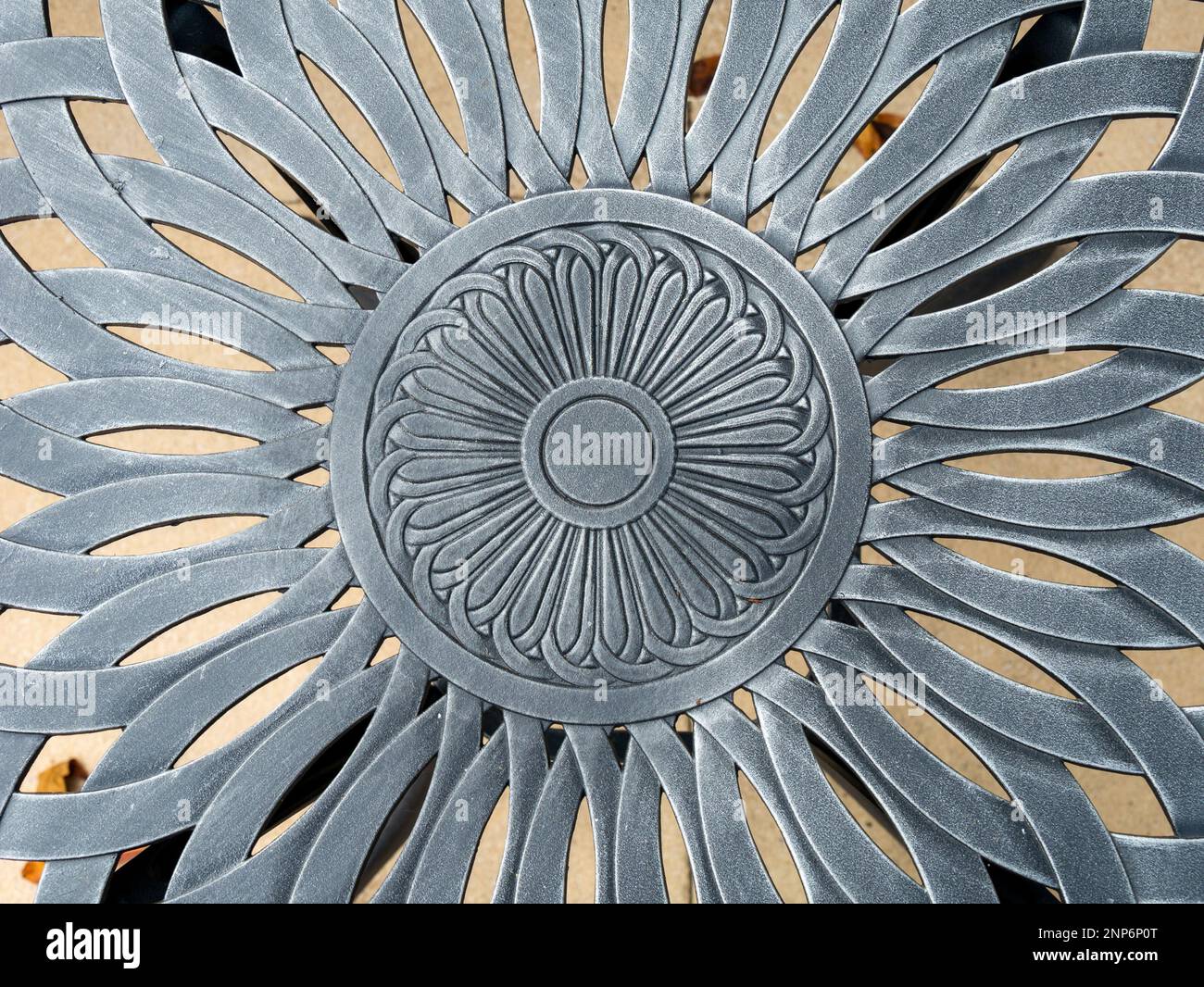 Closeup photo showing detail of floral pattern in cast aluminium metal