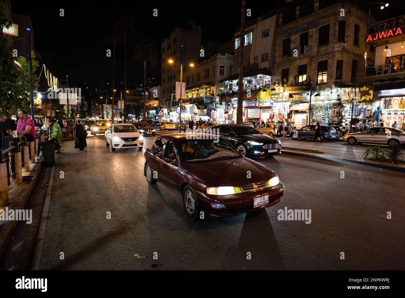 Amman, Jordan - October 23 2022: King Faisal Street in Downtown Amman at Night with Traffic Stock Photo