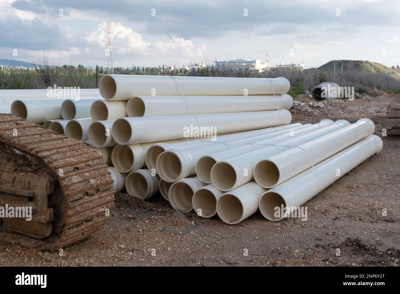 Plumbing. new PVC pipe heap, pile near the construction site for the