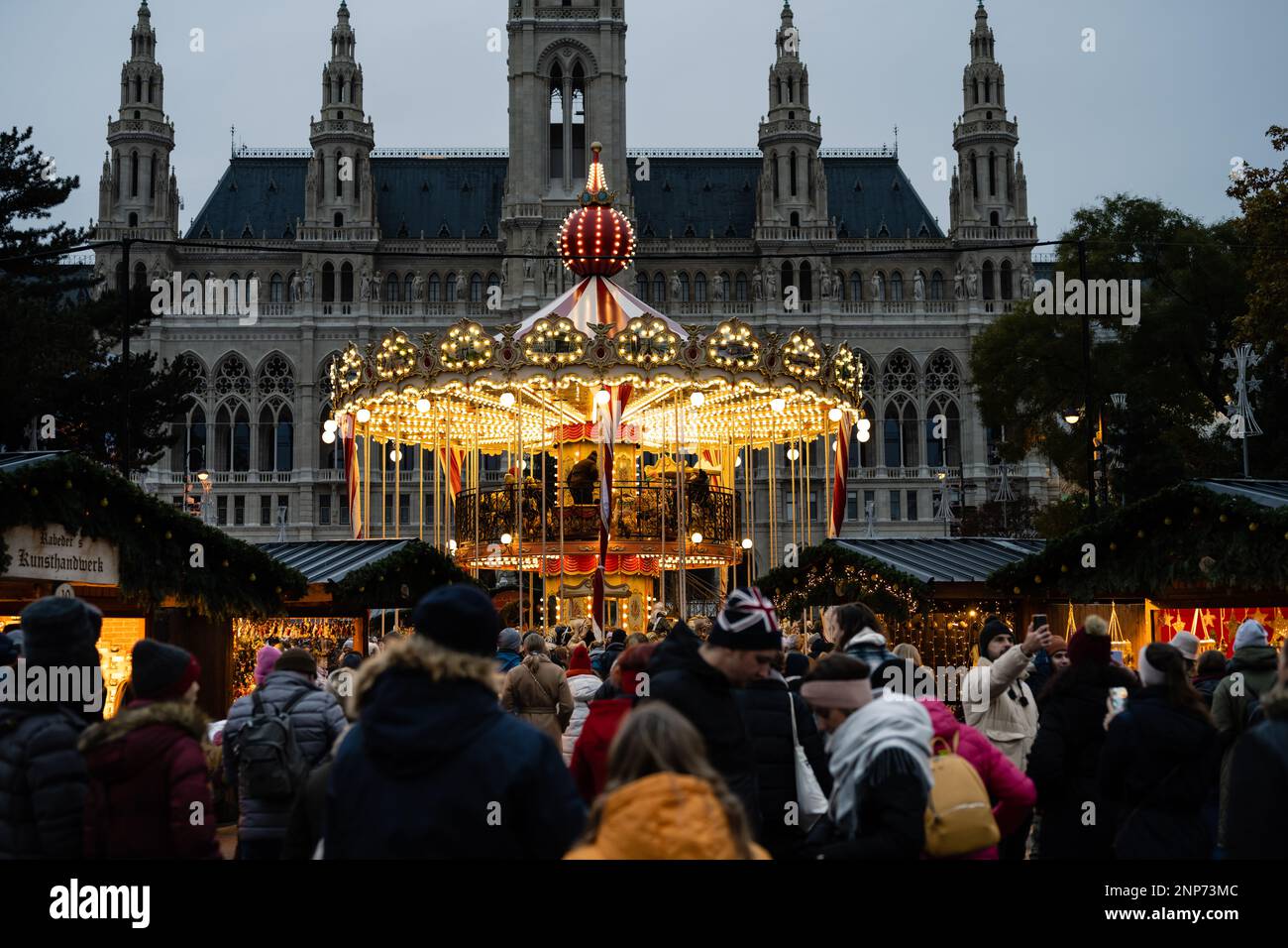 Carousel at the Christmas Market at the Vienna City Hall or Christkindlmarkt beim Rathaus in the Evening Stock Photo