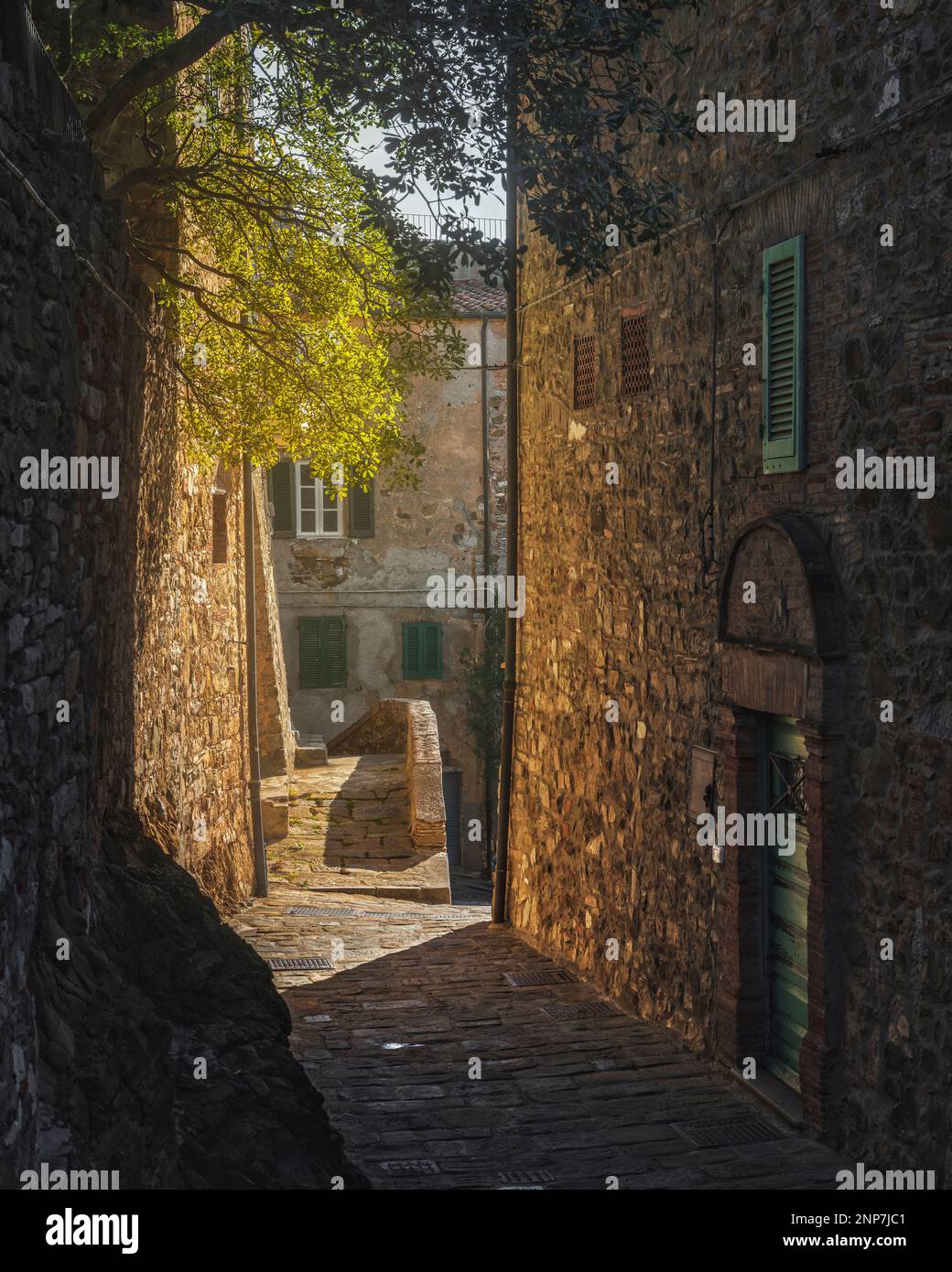 Campiglia Marittima medieval village, sunlit street. Tuscany, Italy, Europe. Stock Photo
