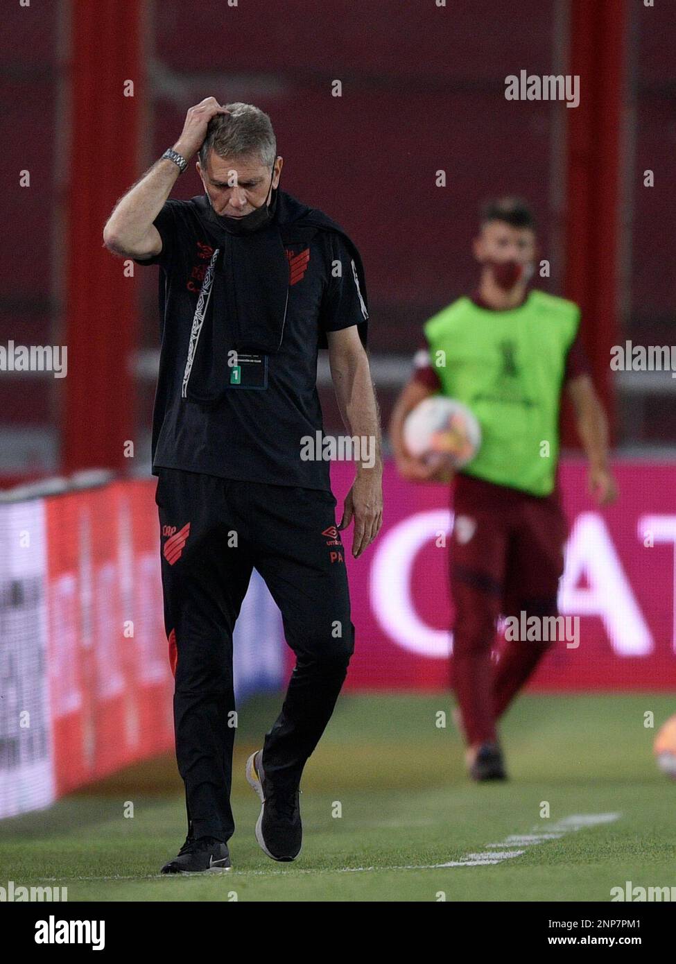 Coach Paulo Autori of Brazil's Athletico Paranaense scratches his head  during a Copa Libertadores round of sixteen second leg soccer match against  Argentina's River Plate at the Libertadores de America stadium in