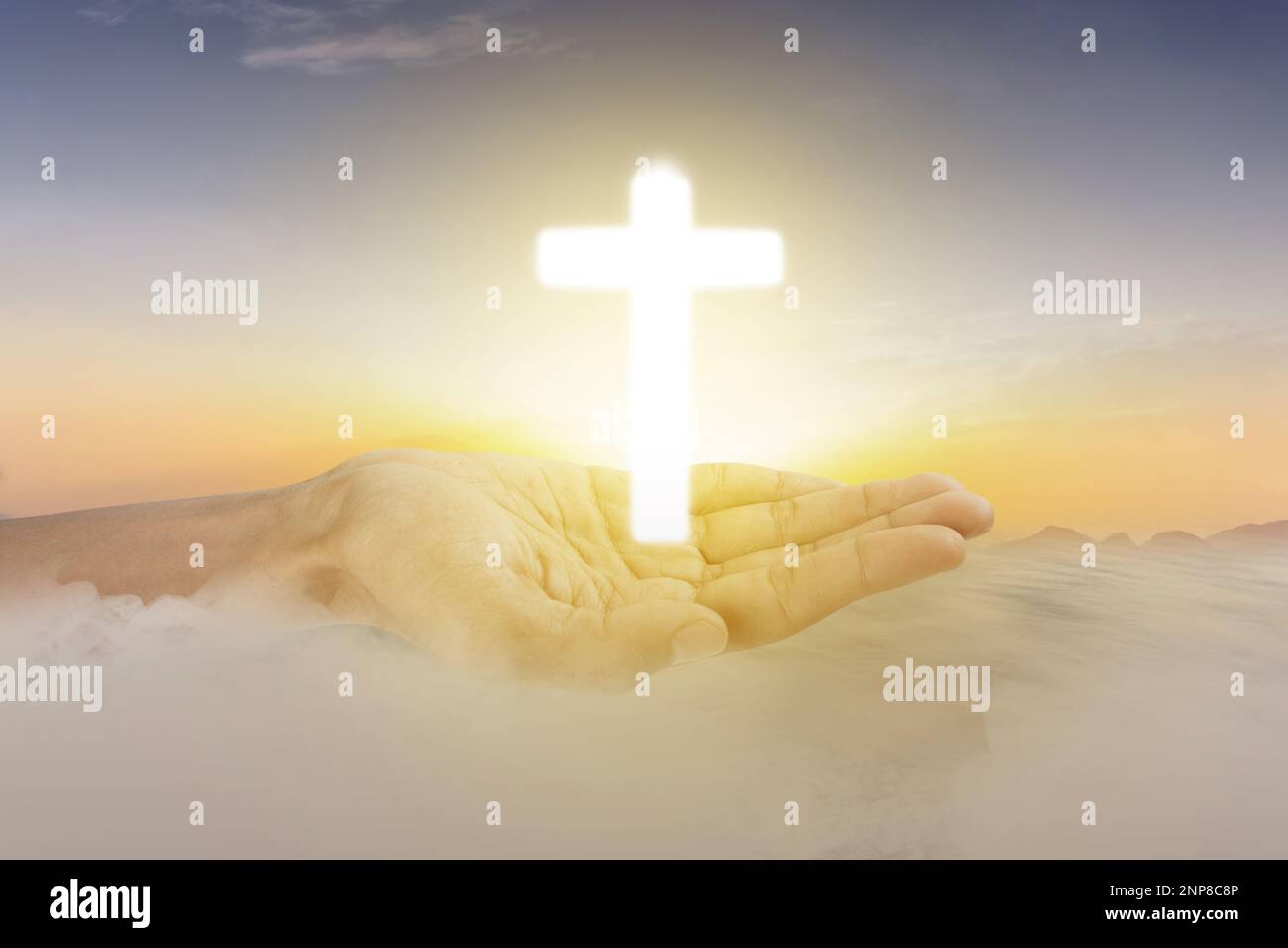 Human hand showing Christian cross with sunset sky background Stock ...