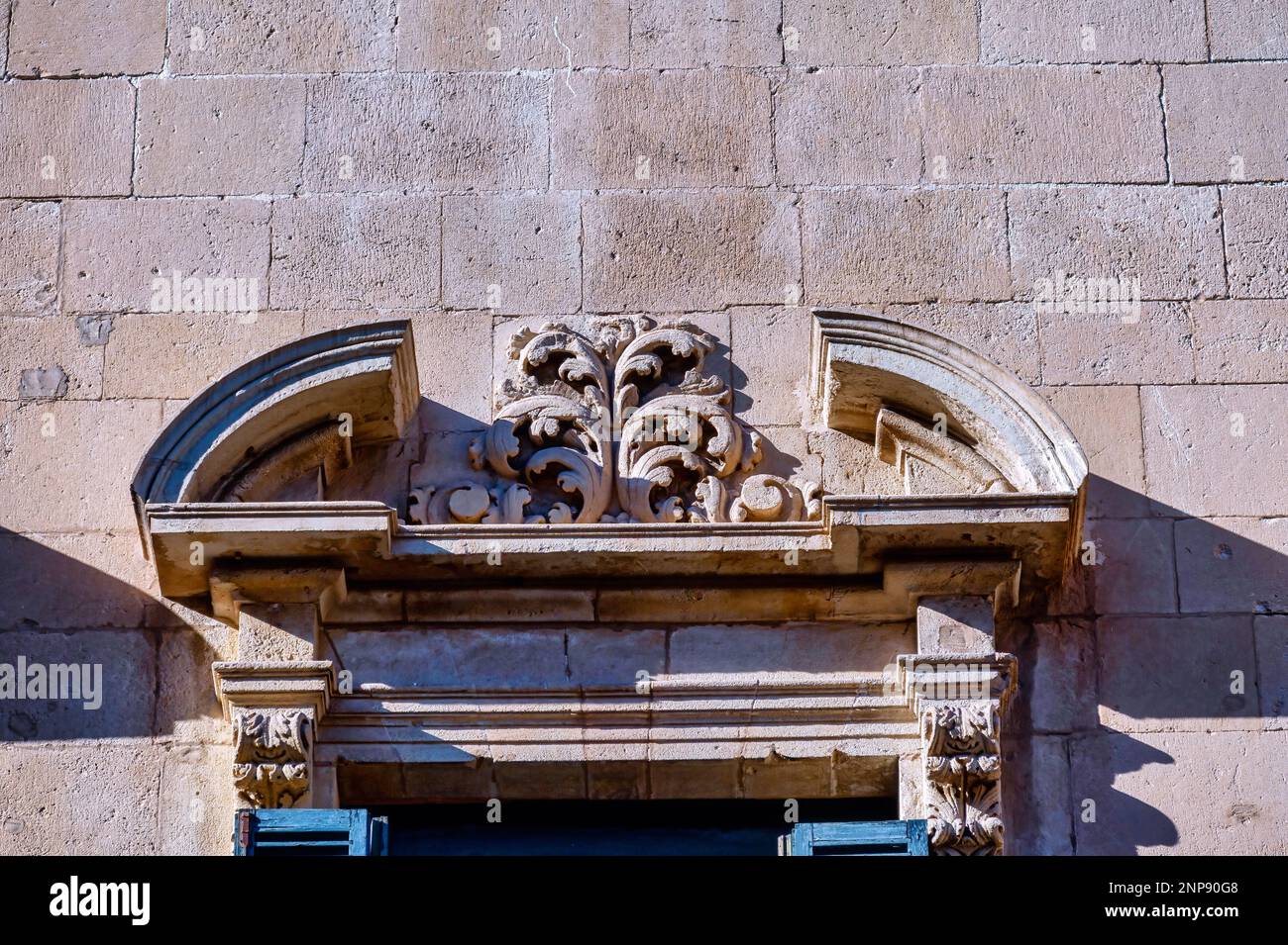 Alicante City Hall (Ayuntamiento). Stone capital decorating the top of a window Stock Photo
