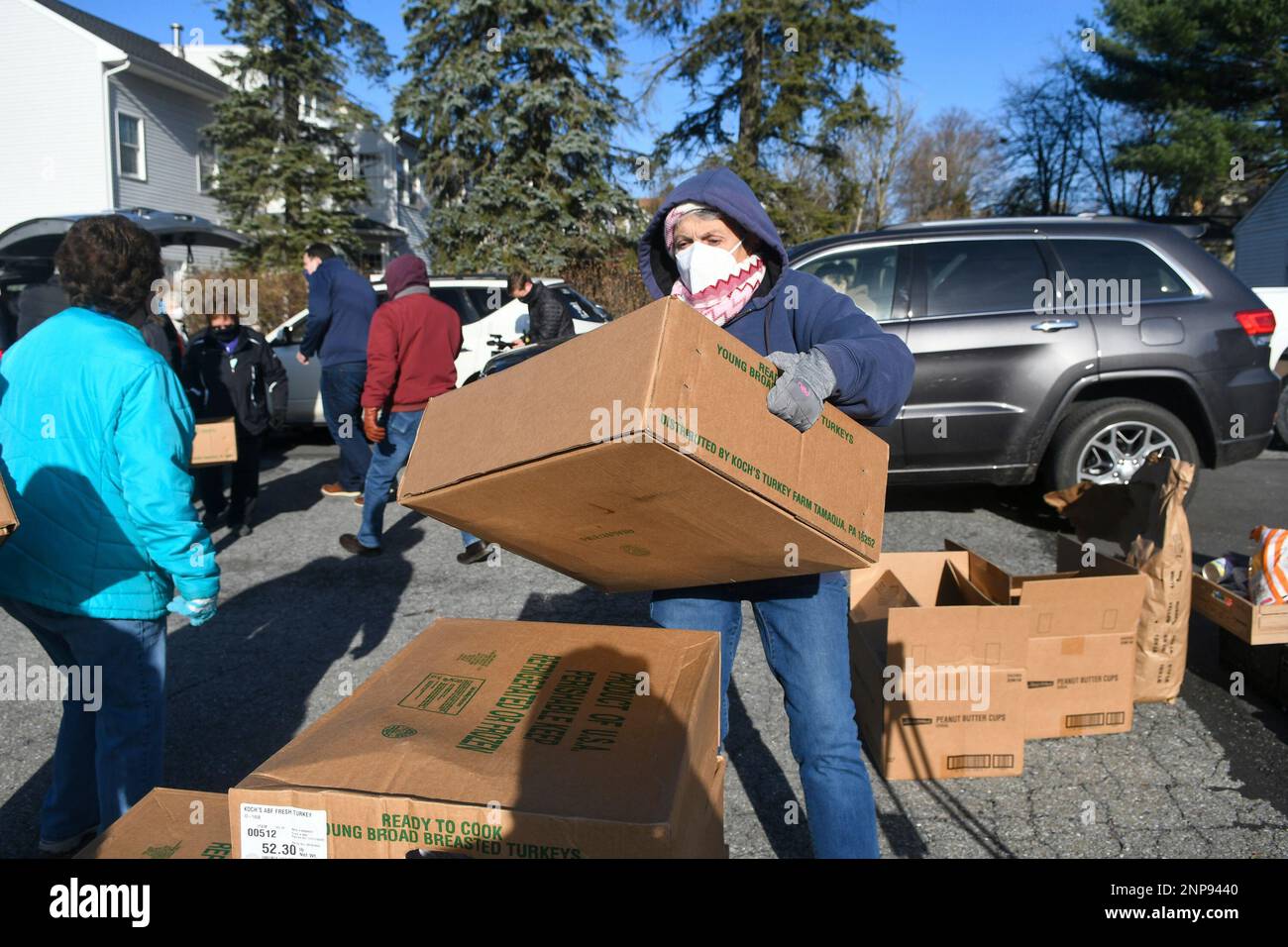 Theresa Reed, of Frackville, Pa., stacks boxes of turkeys that arrived
