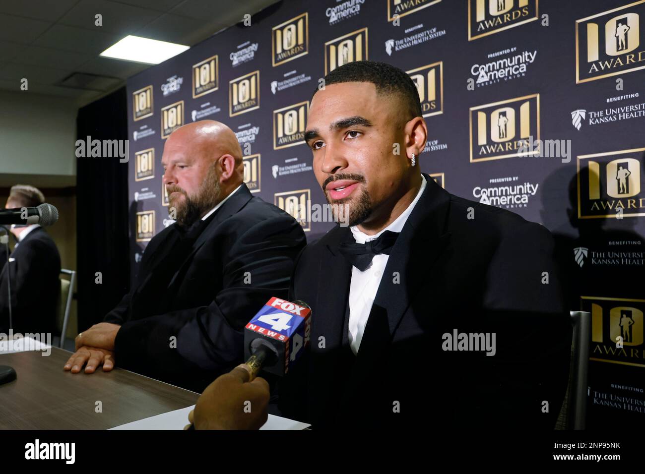 Philadelphia Eagles quarterback Jalen Hurts, right, recipient of the NFC Offensive Player of the
