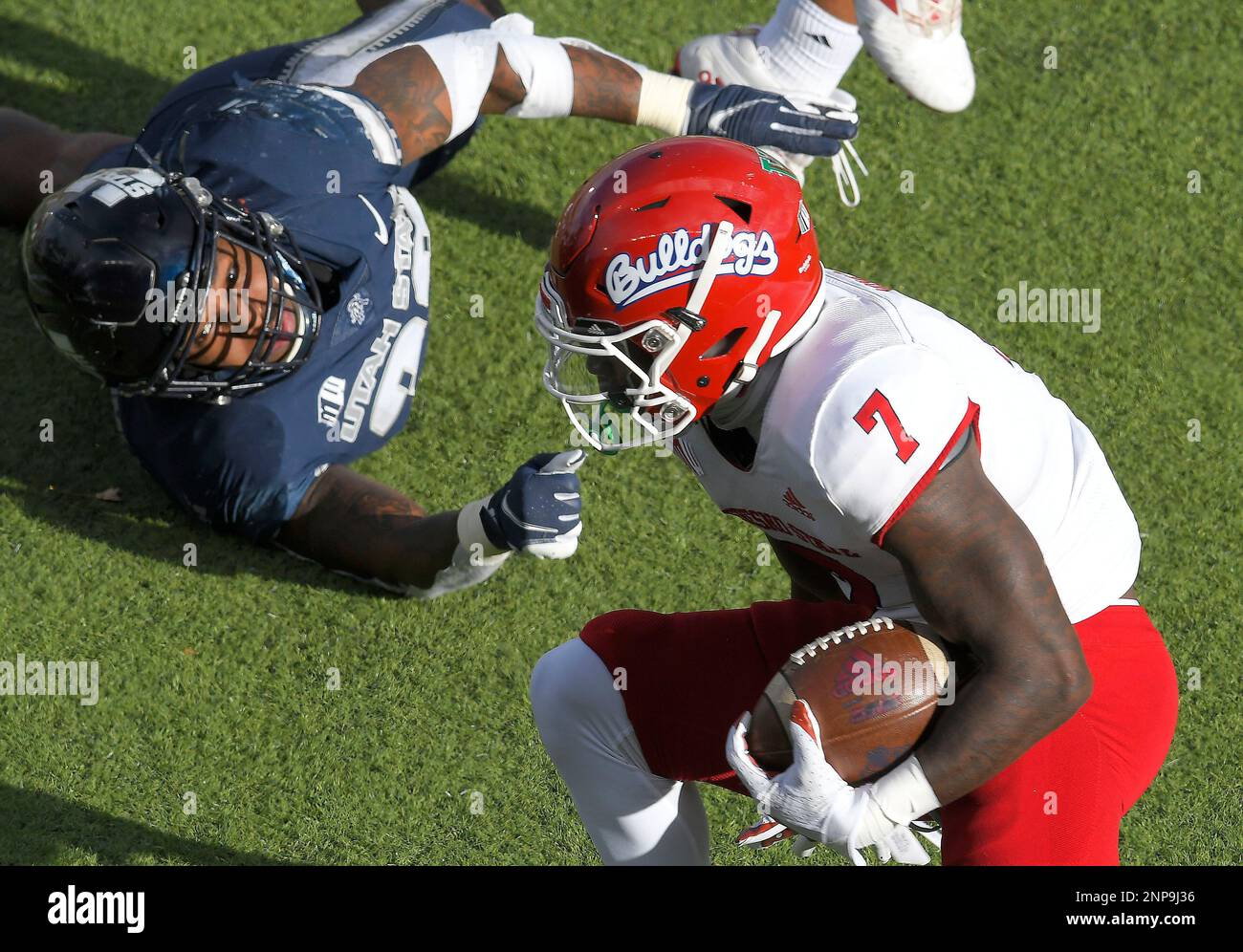 Fresno State running back Jordan Mims (7) runs past Utah State