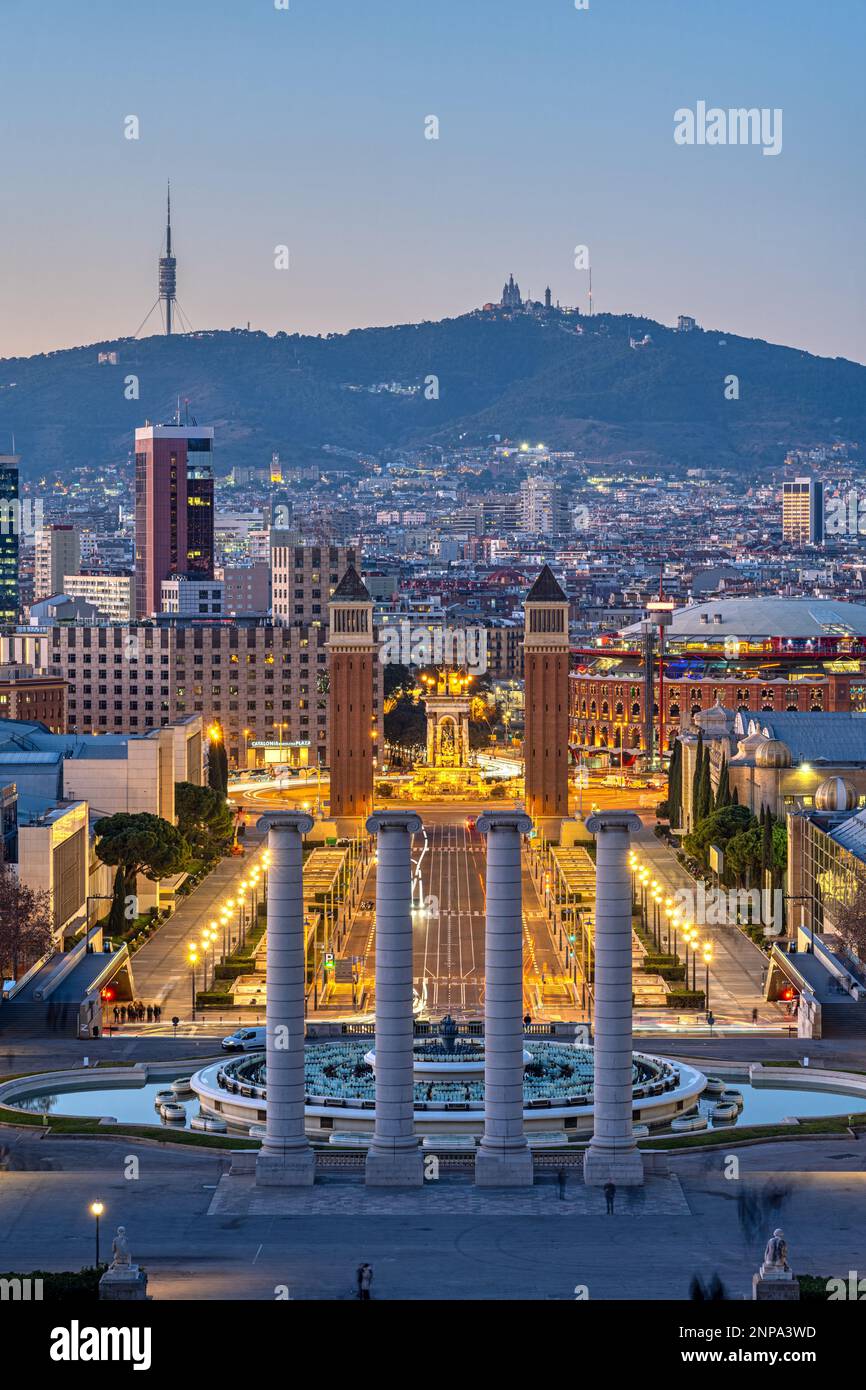 Barcelona at dusk with the Plaza de Espana and Mount Tibidabo in the back Stock Photo
